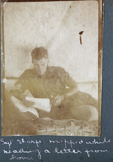 Wallace Sharpe reading a letter from home